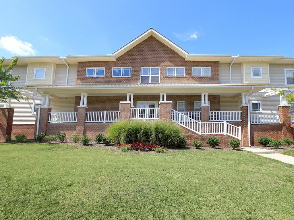 a large house with a yard in front of it