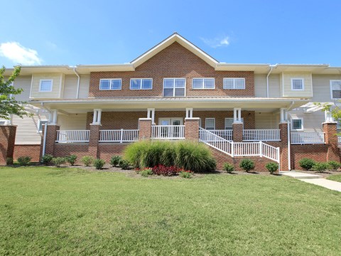 a large house with a yard in front of it