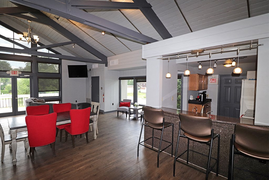 a view of the dining room and living room from the kitchen