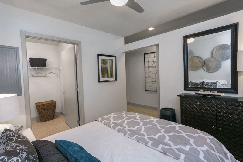 a bedroom with a bed and a closet