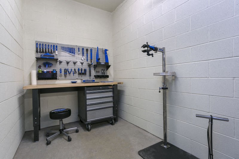 a workspace with a desk and a light in a room