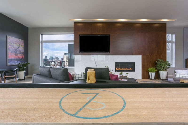 a living room with a couch and a fireplace