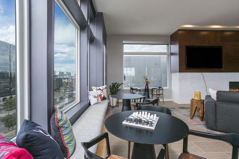 a living room with a table with a chess game on it