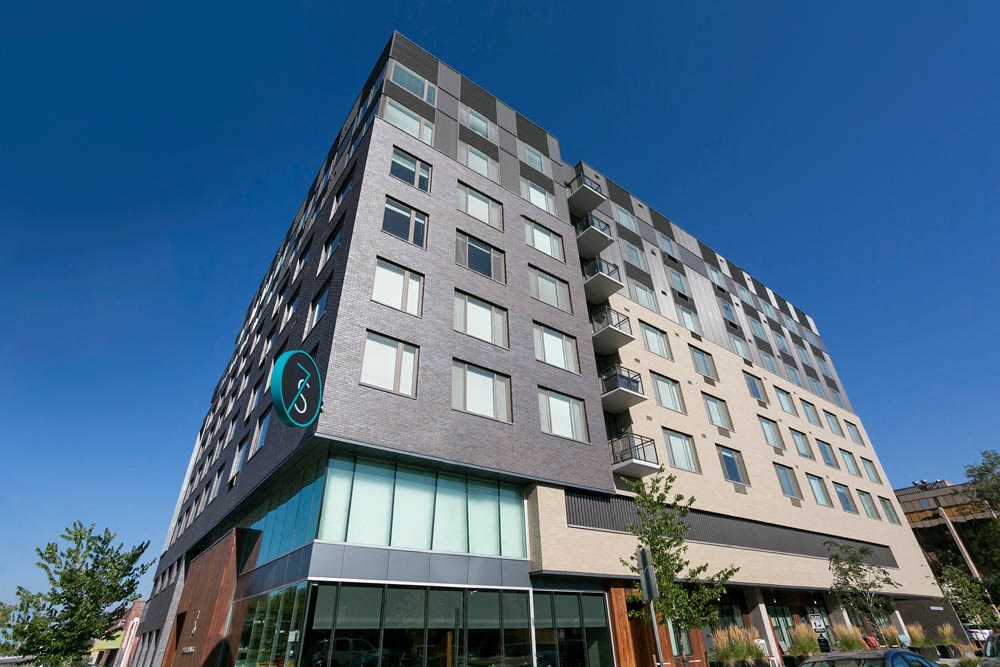 a tall building with a sign on the side of it