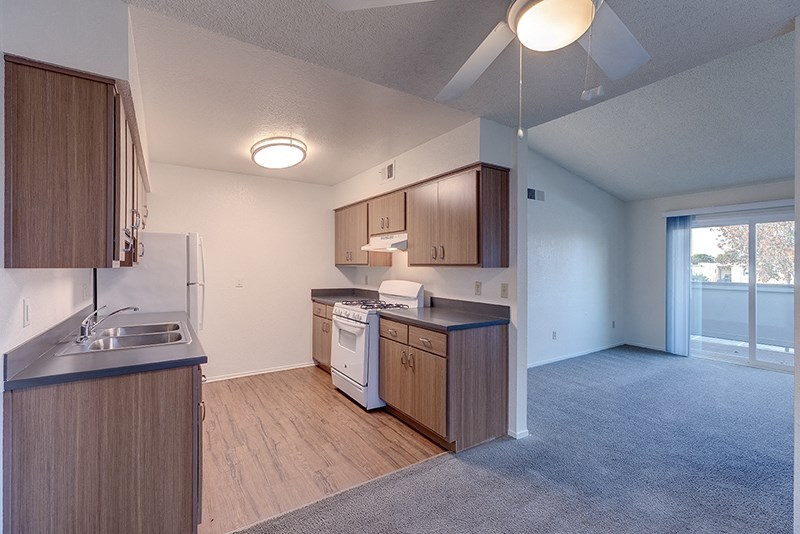 Kitchen with cabinets at VINE BY VINTAGE Apartments, California, 93436