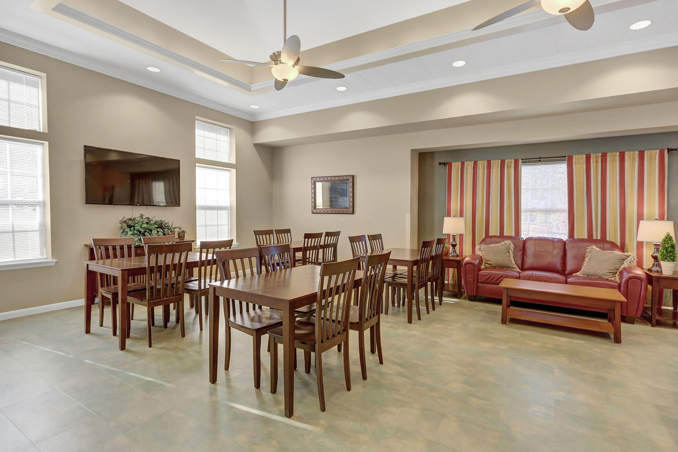 a dining room and living room with a table and chairs