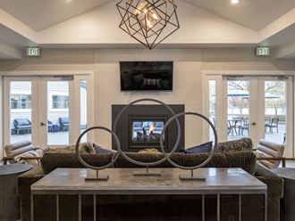 Posh Lounge Area With Fireplace In Clubhouse at Edgewater Apartments, Idaho - Photo Gallery 2