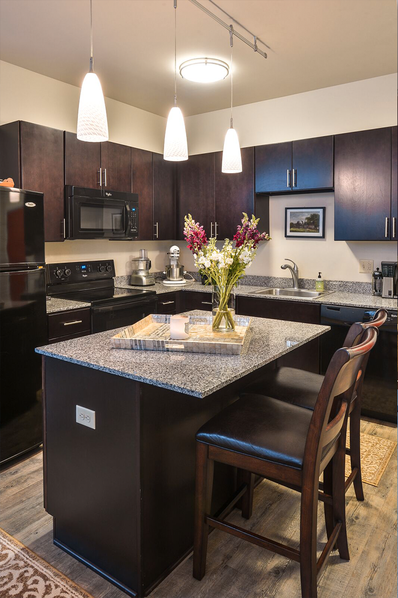 a kitchen with a granite counter top
