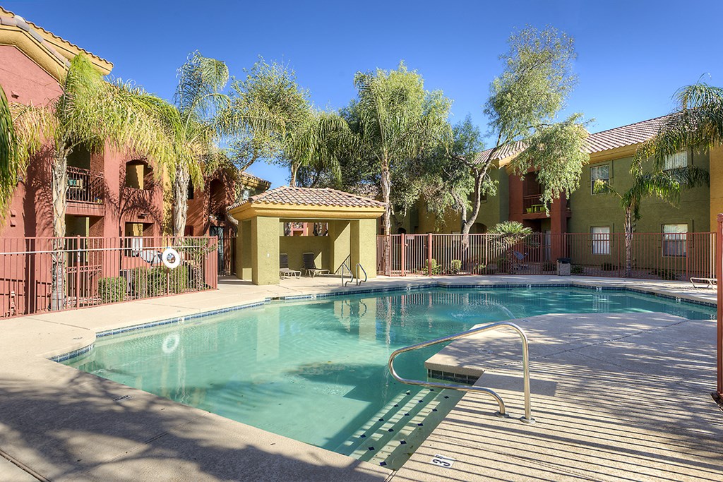 a swimming pool in front of a building