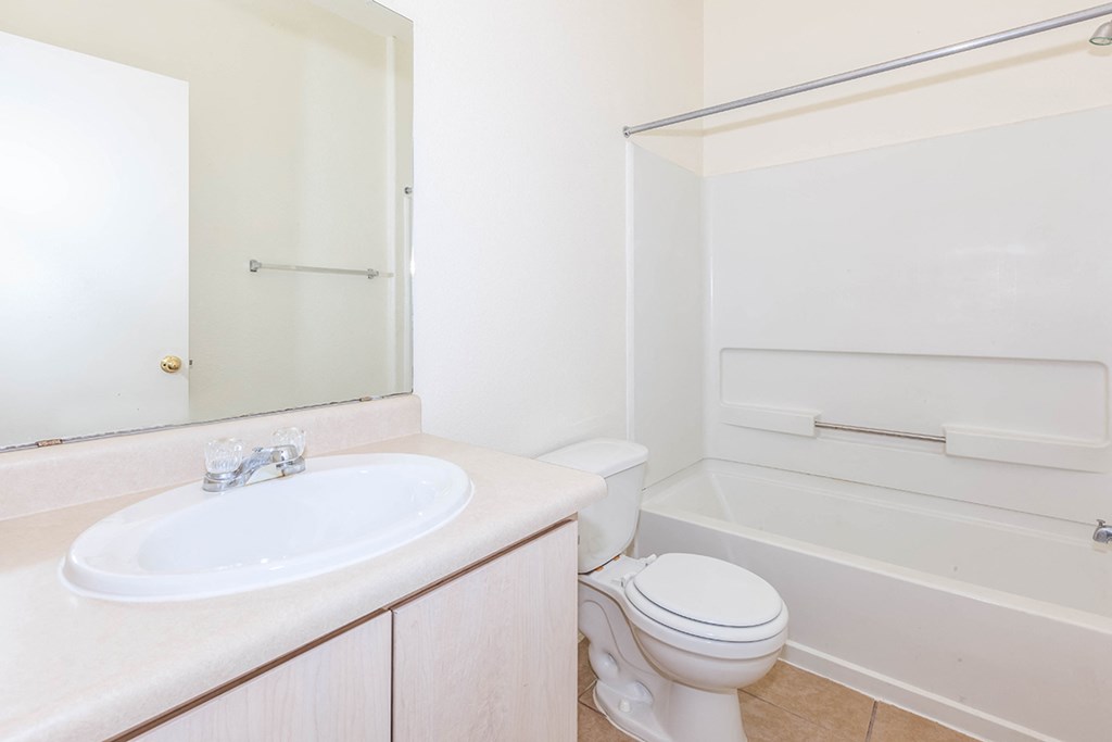 a bathroom with a sink toilet and a shower