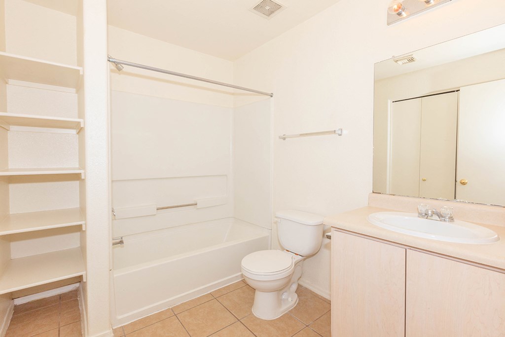 a bathroom with a sink toilet and a bath tub