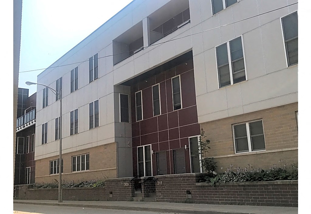 a large building with a street in front of it