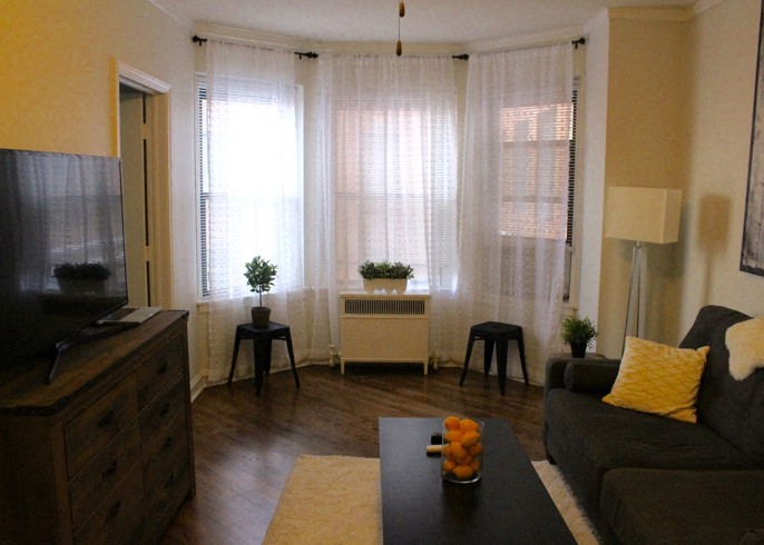 a living room with a couch and a television