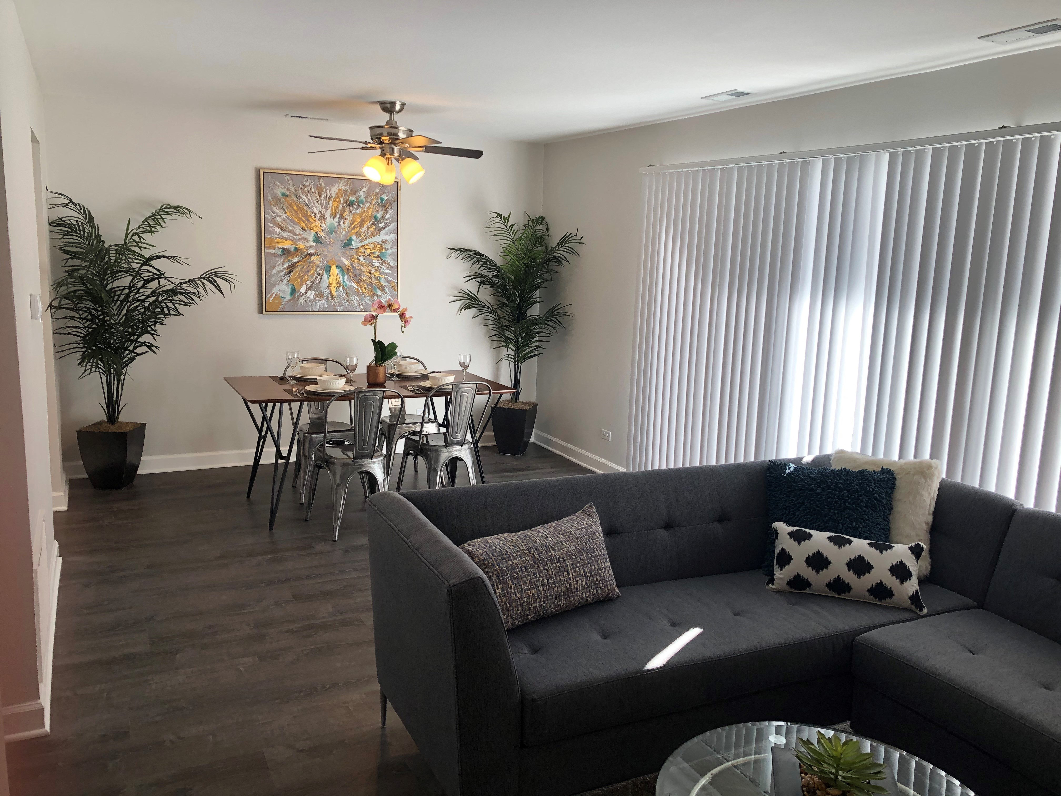 a living room and dining room with a couch and a table