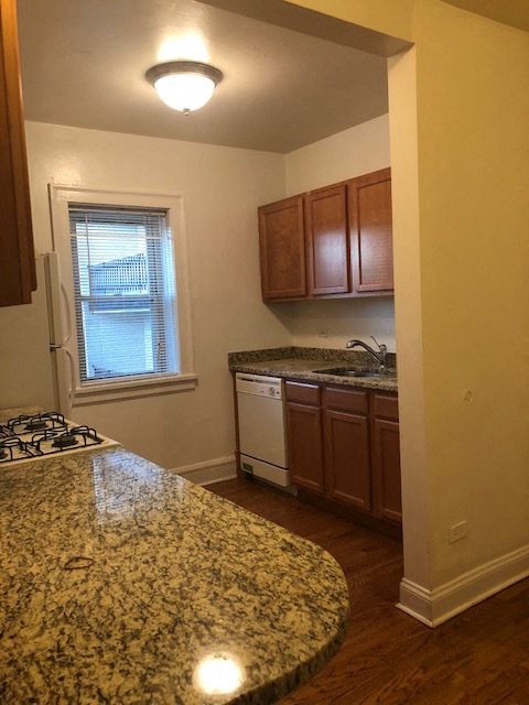 a kitchen with a counter top and a sink