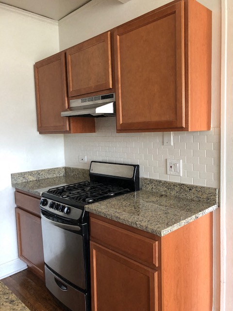 a kitchen with a stove and a counter top