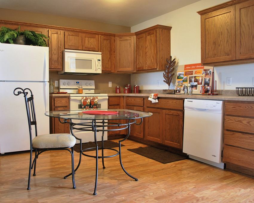 a kitchen with a small table in the middle