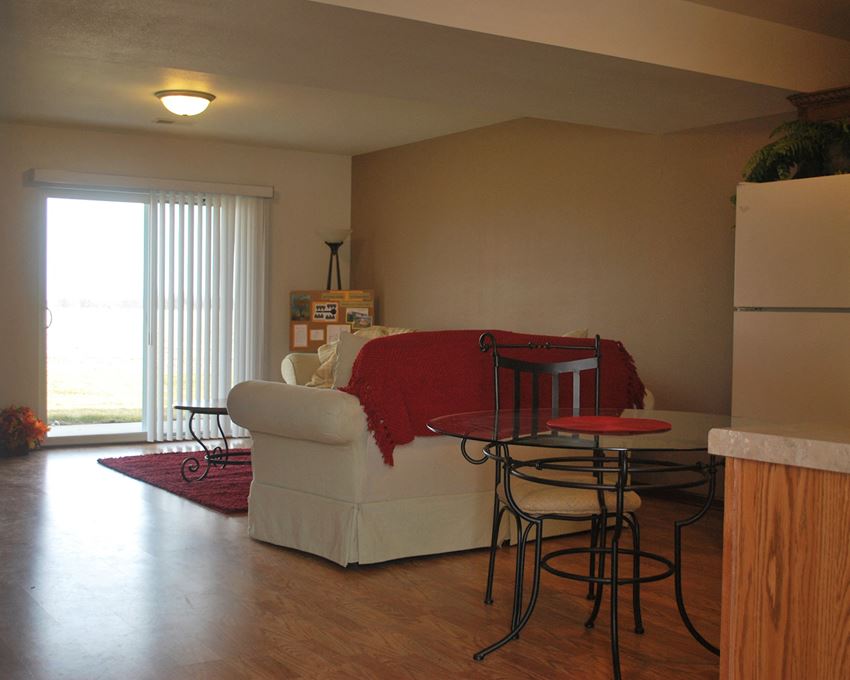 a living room with a couch and a dining room table