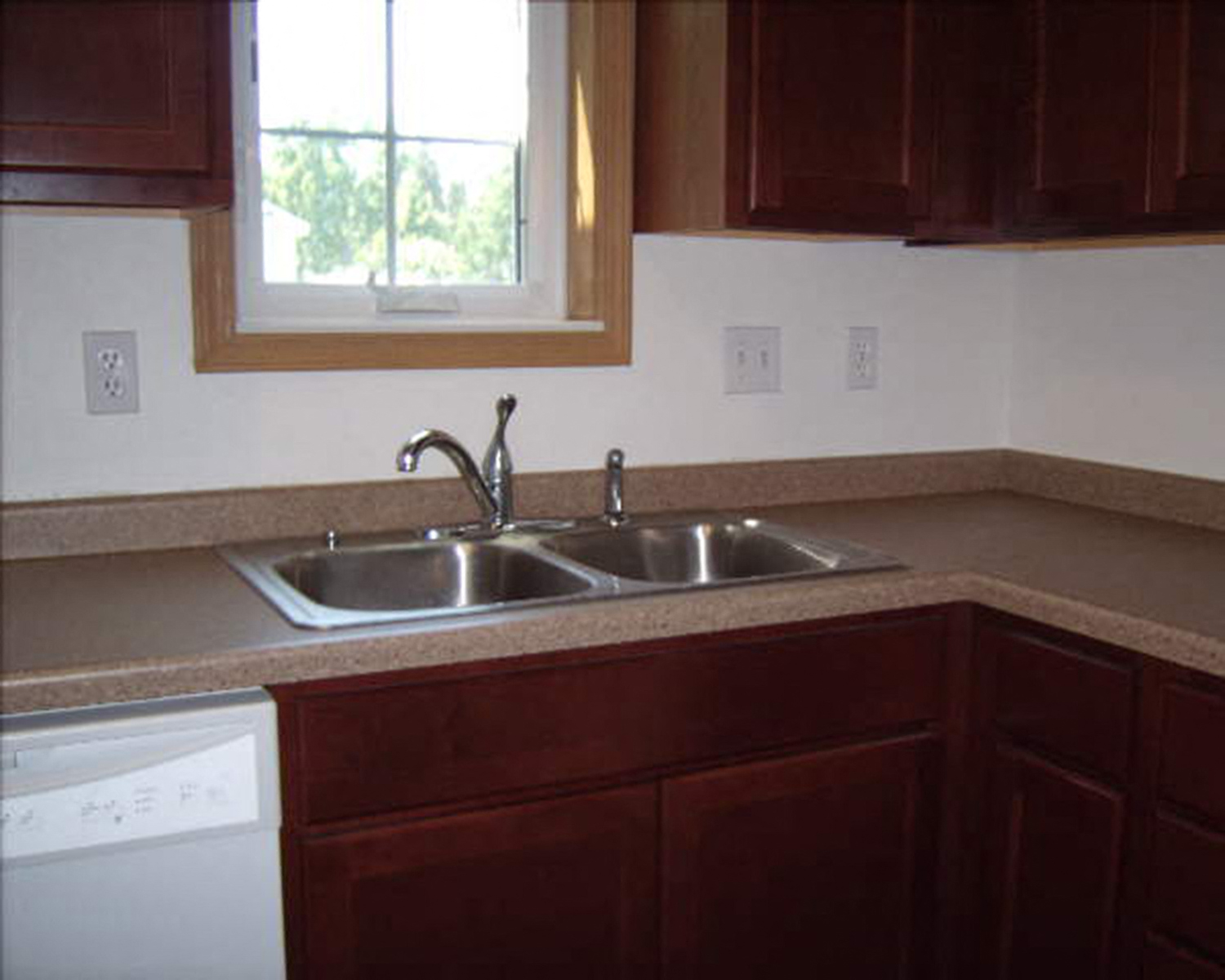 a kitchen with a sink and a window