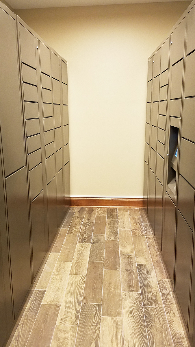 a row of lockers in a room with wood floors