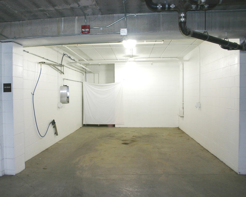 a white room with a white curtain in the middle of it