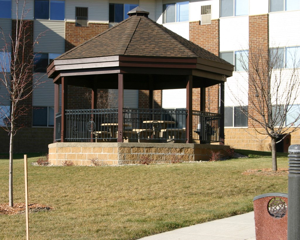 a gazebo in front of a building