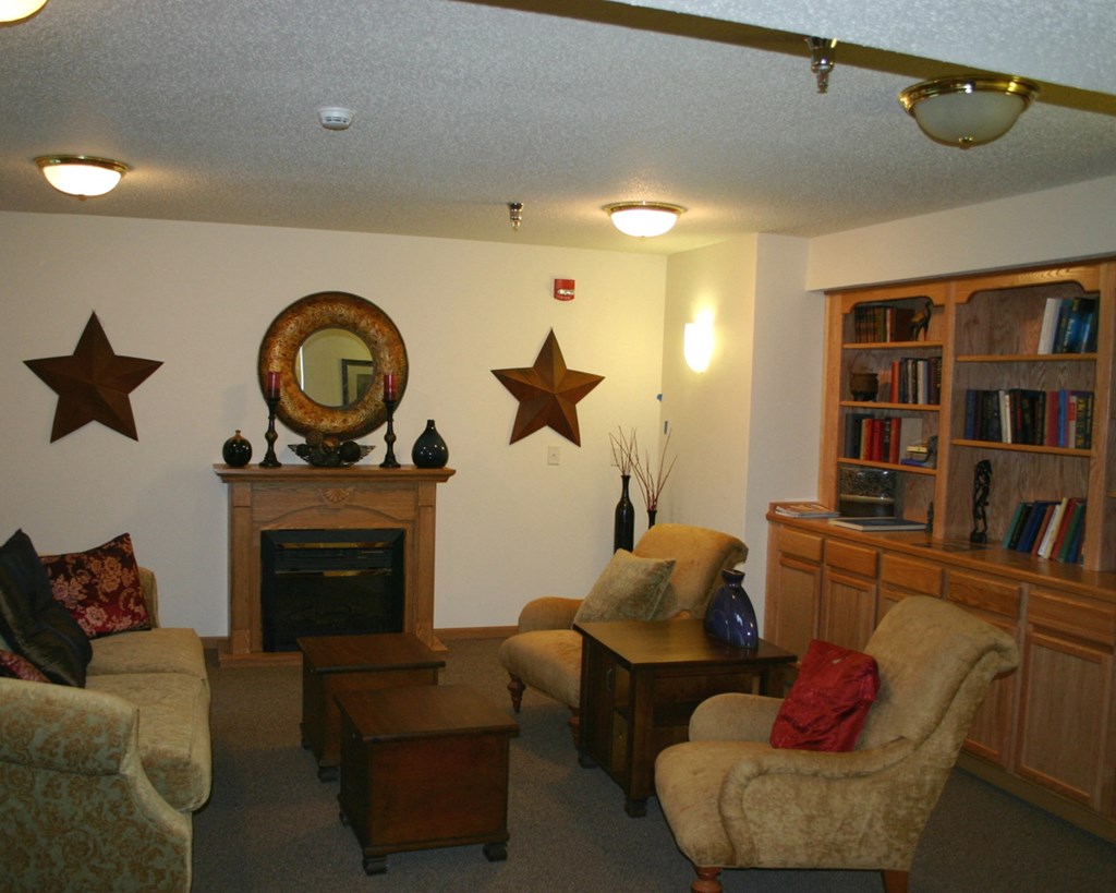 a living room filled with furniture and a fireplace