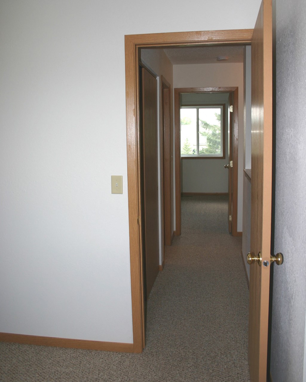 the hallway from the living room to the master bedroom