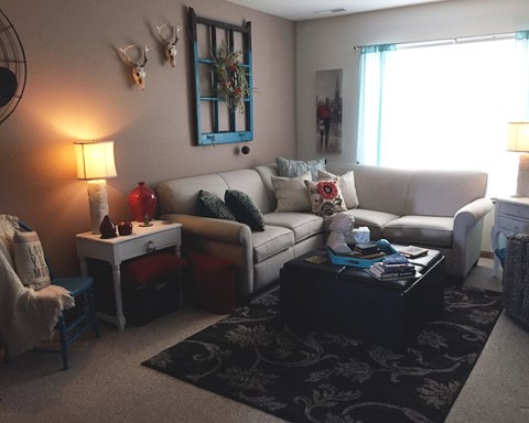 a living room with a couch and a table