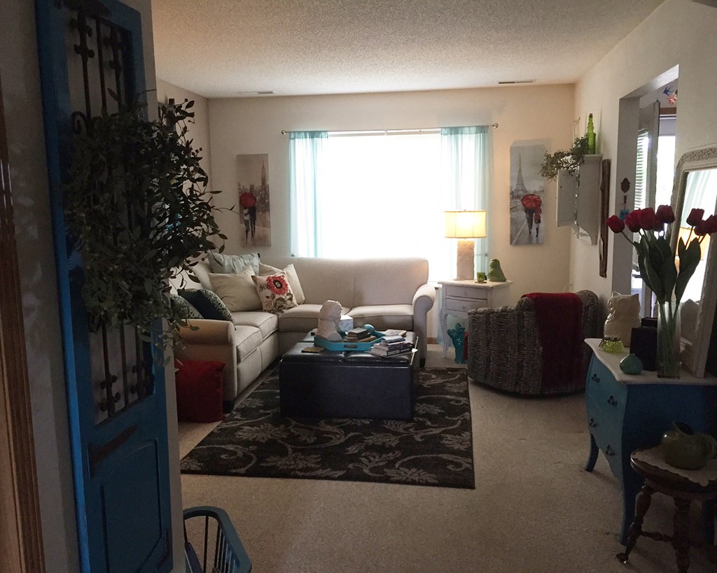 a living room with a couch and a table