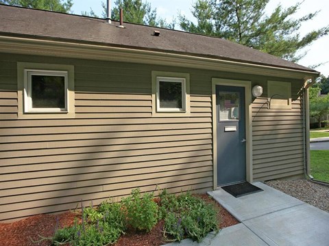the front of a house with a blue door