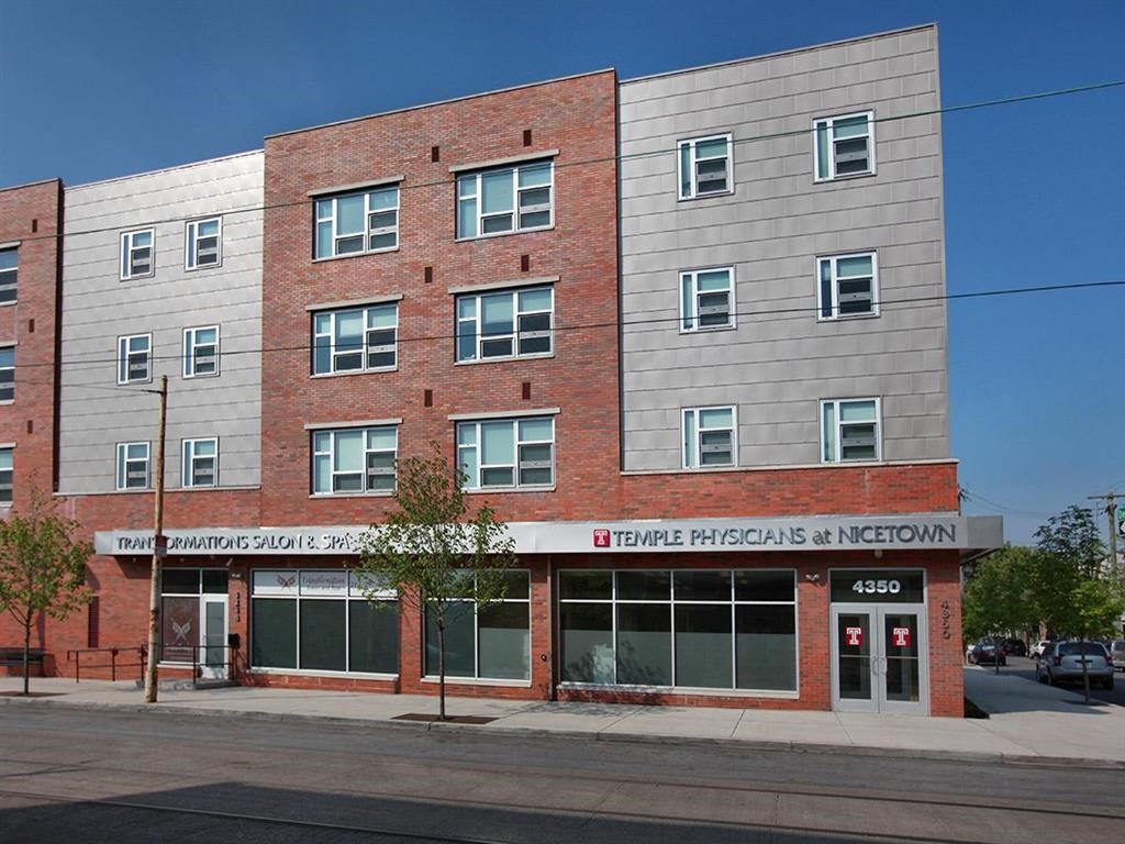 a large brick building on the side of a street
