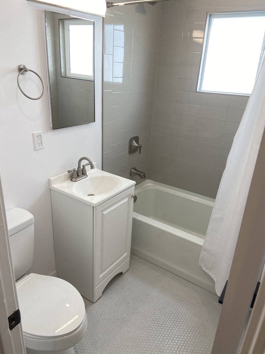 a bathroom with a sink toilet and a bath tub