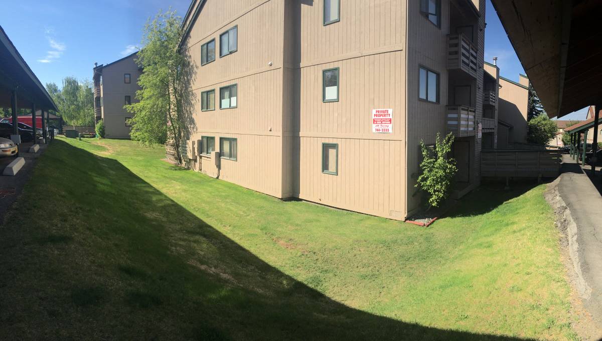a building with a green lawn in front of it