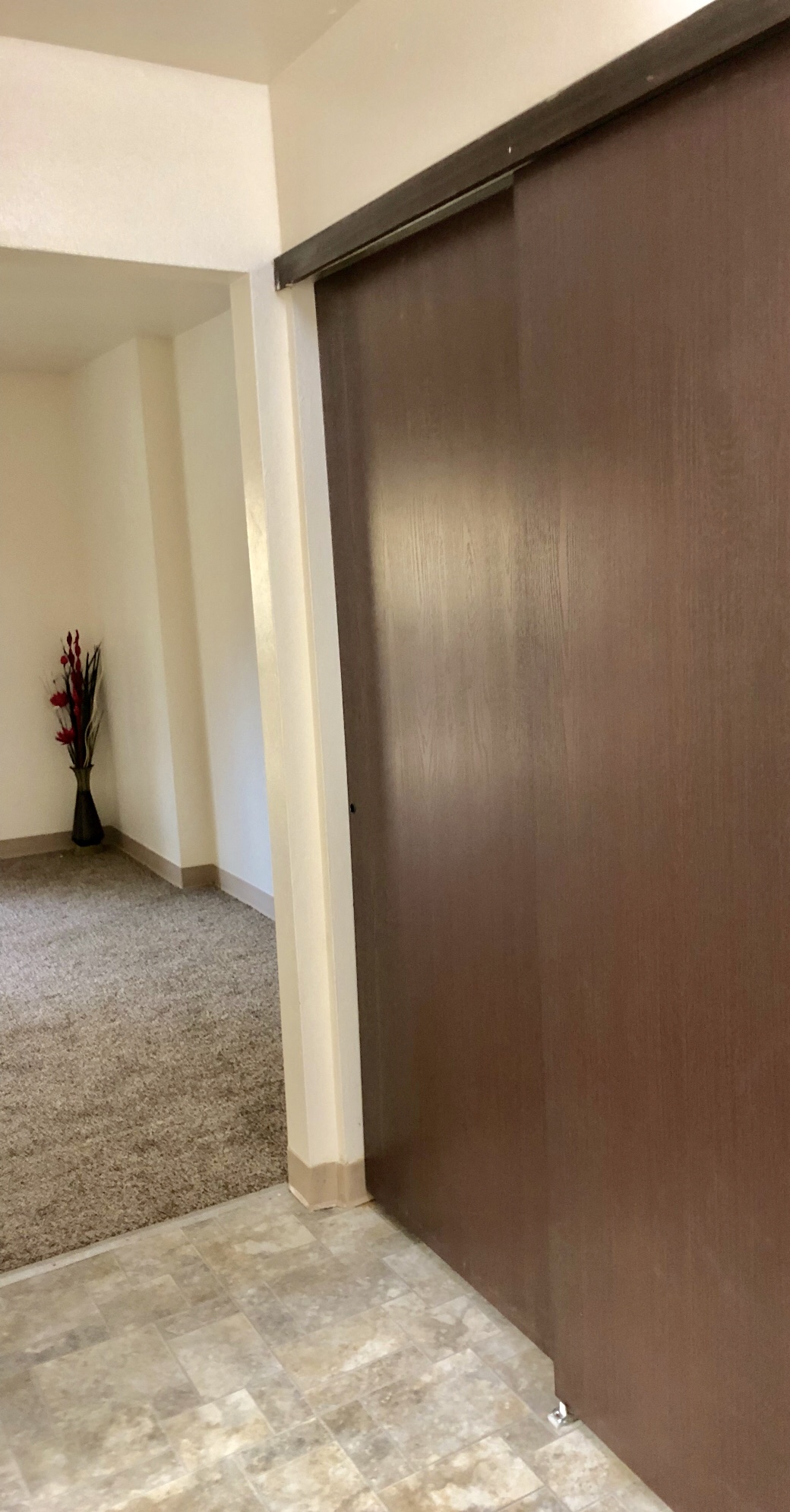 a sliding door in an empty room in a house