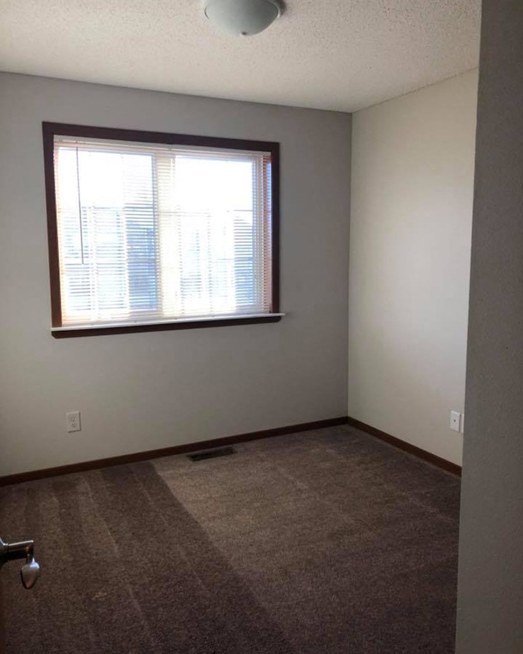 an empty room with a window in it