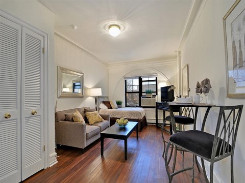 a living room with a couch and a table