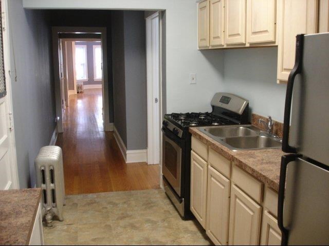 a kitchen with a stove and a sink