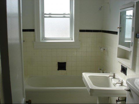 a bathroom with a sink and a bath tub