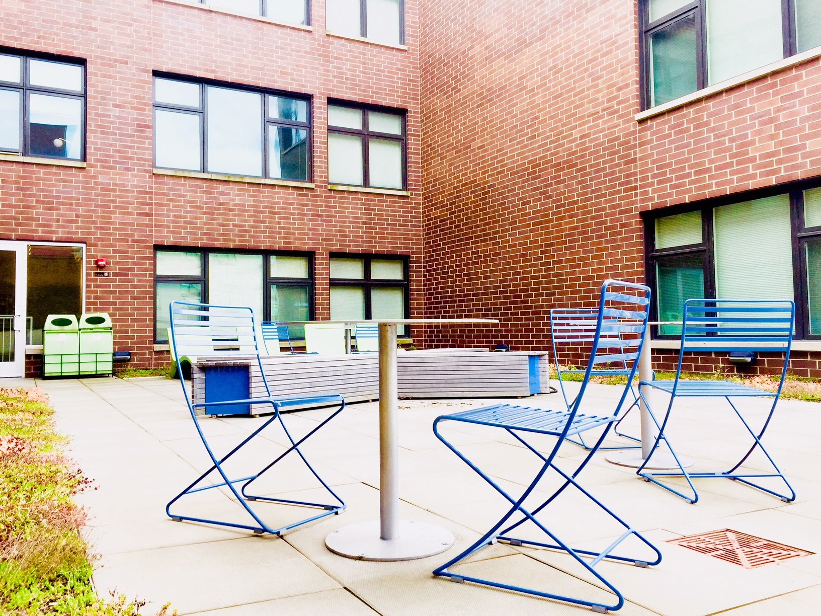 our patio in front of our building has a table and chairs