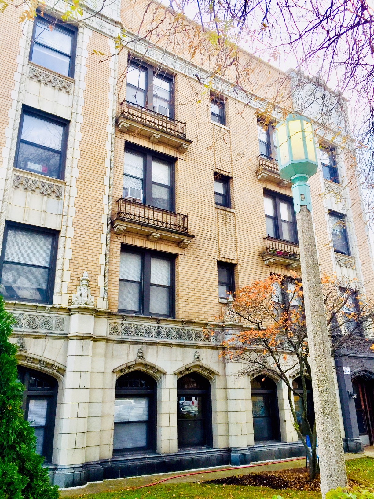 a tall building with a street light in front of it
