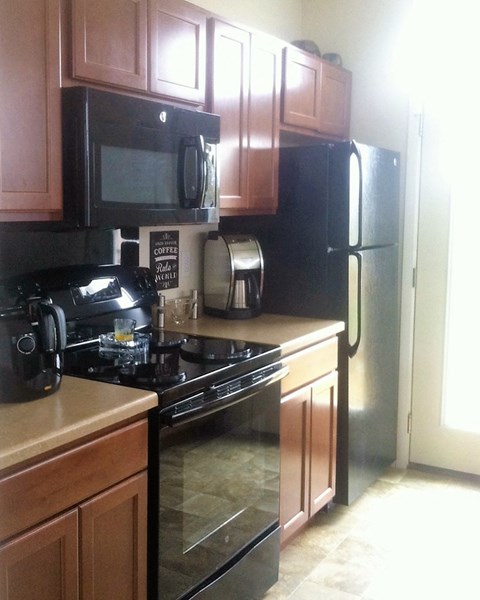 a kitchen with a stove and a refrigerator