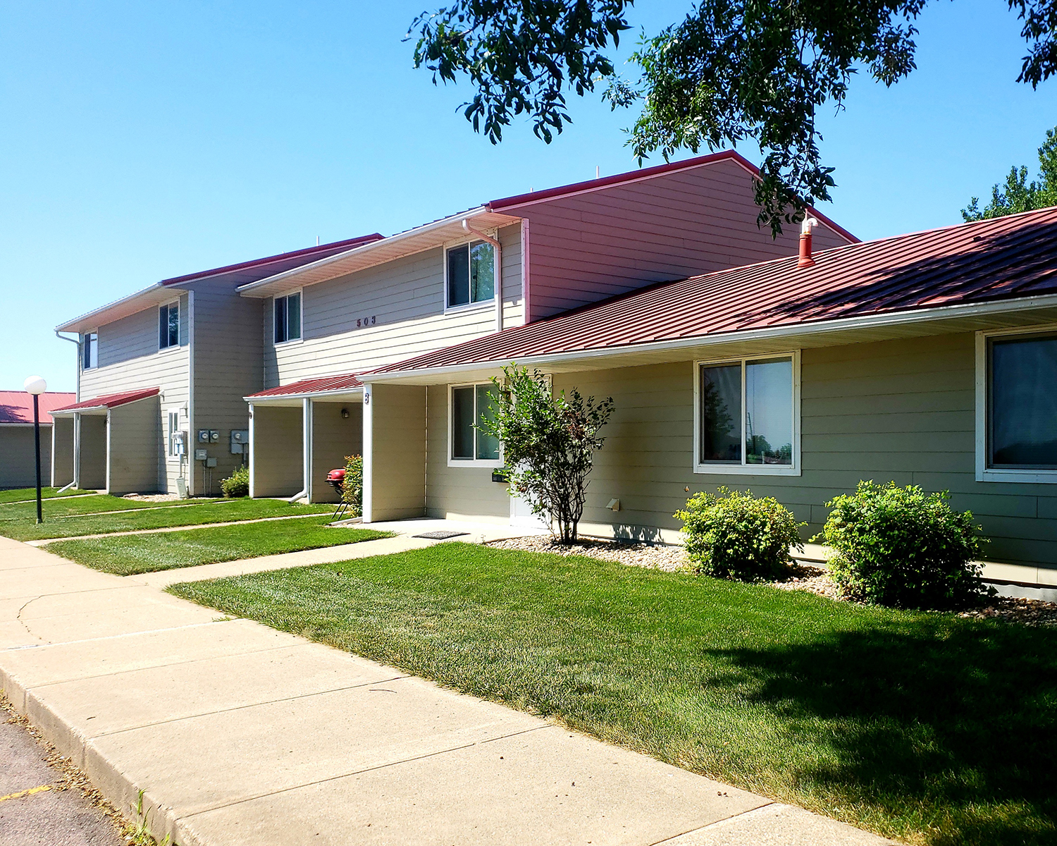 a house with a sidewalk in front of it