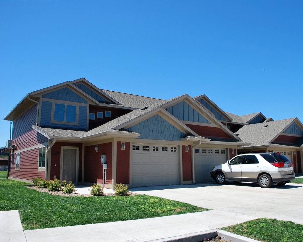 a house with a car parked in front of it