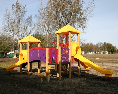 a colorful playground with a slide and other playset