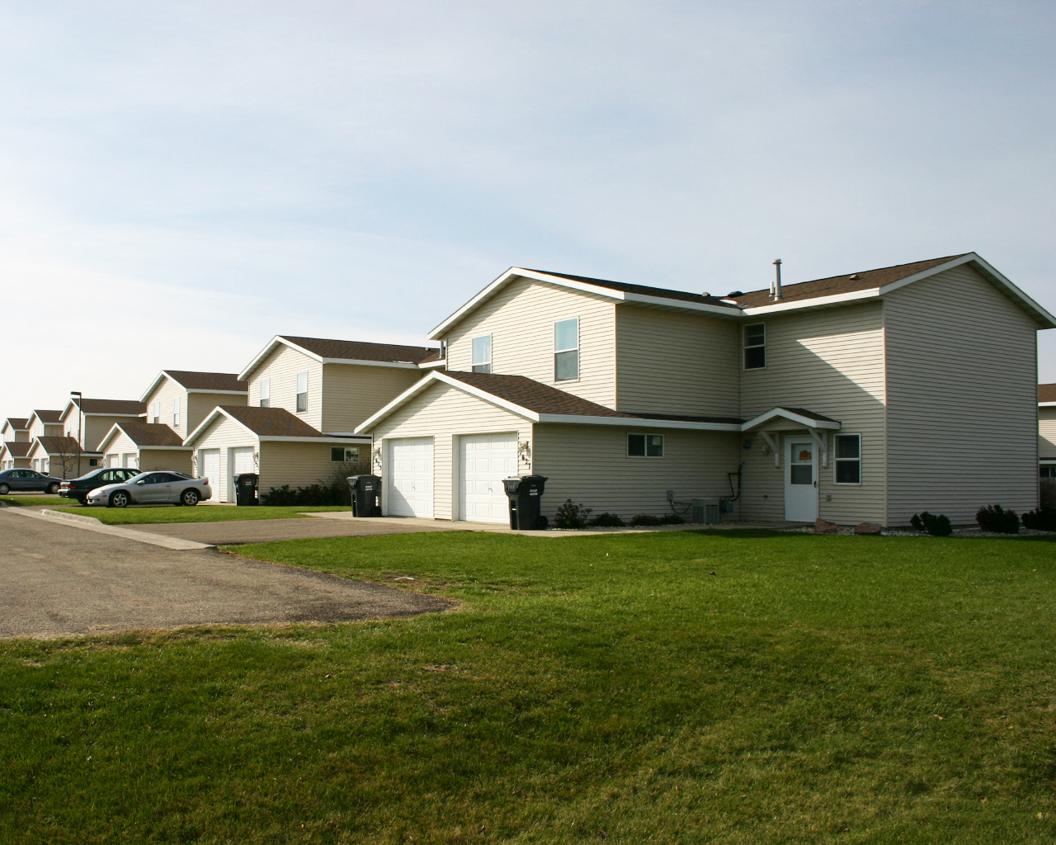 a row of houses on the side of a road