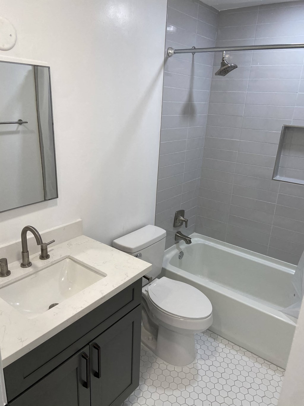 a bathroom with a sink toilet and a bath tub