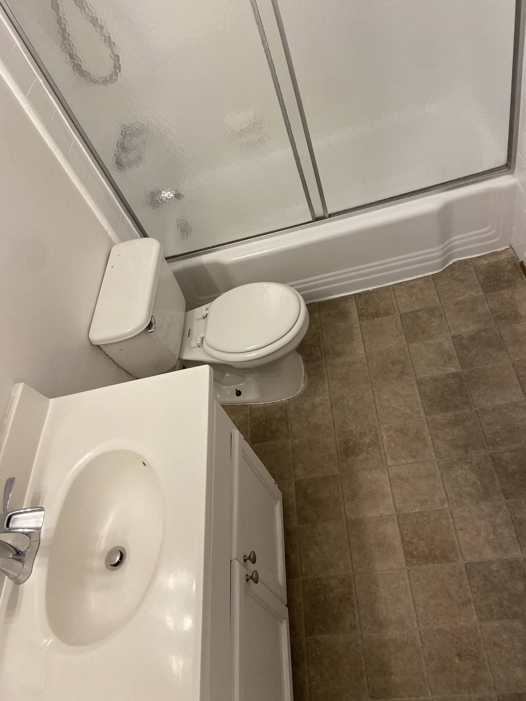 a small bathroom with a toilet and a shower
