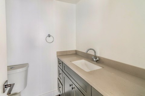 an empty bathroom with a sink and a toilet