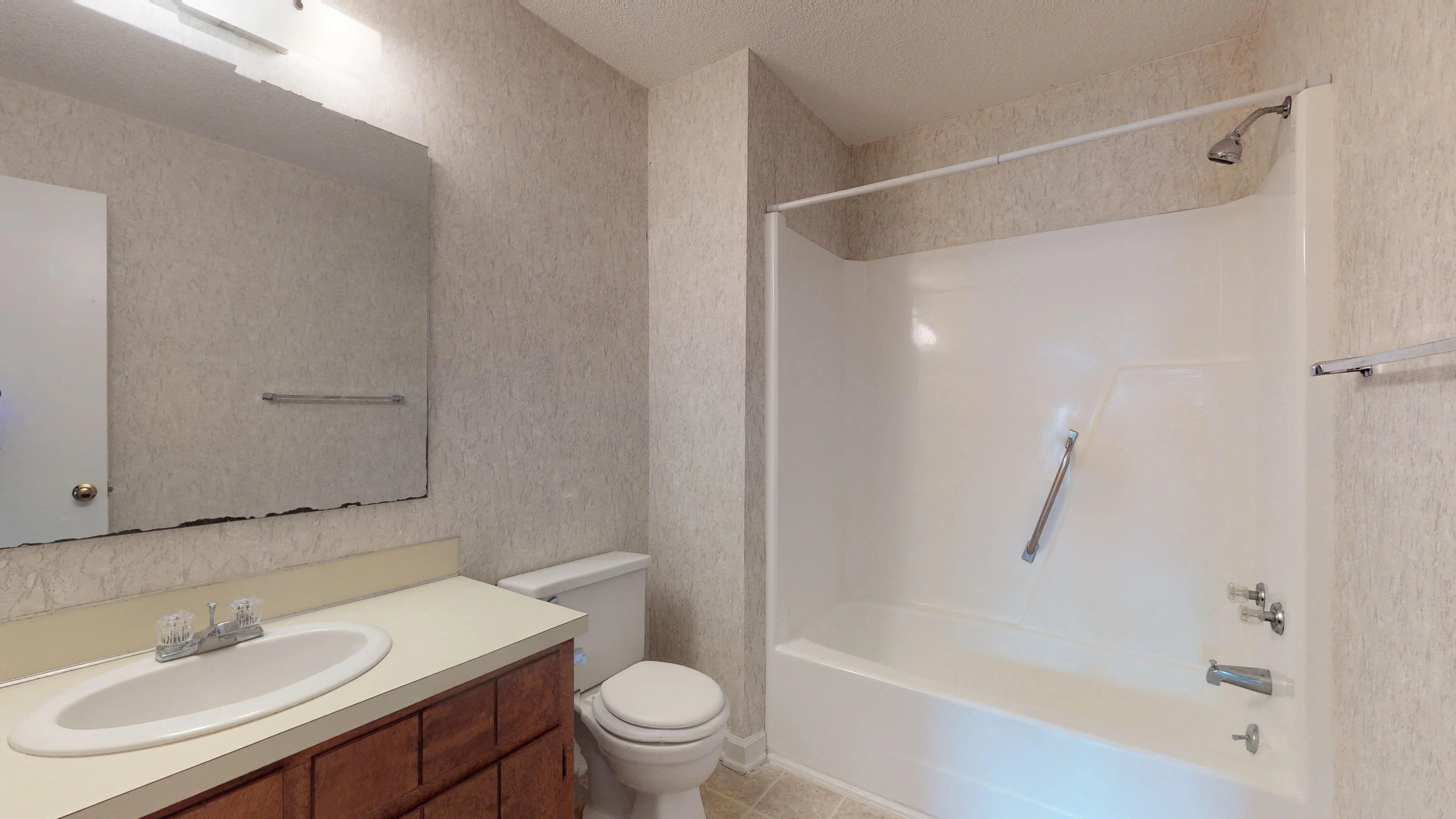 the preserve at ballantyne commons apartment bathroom with sink toilet and tub
